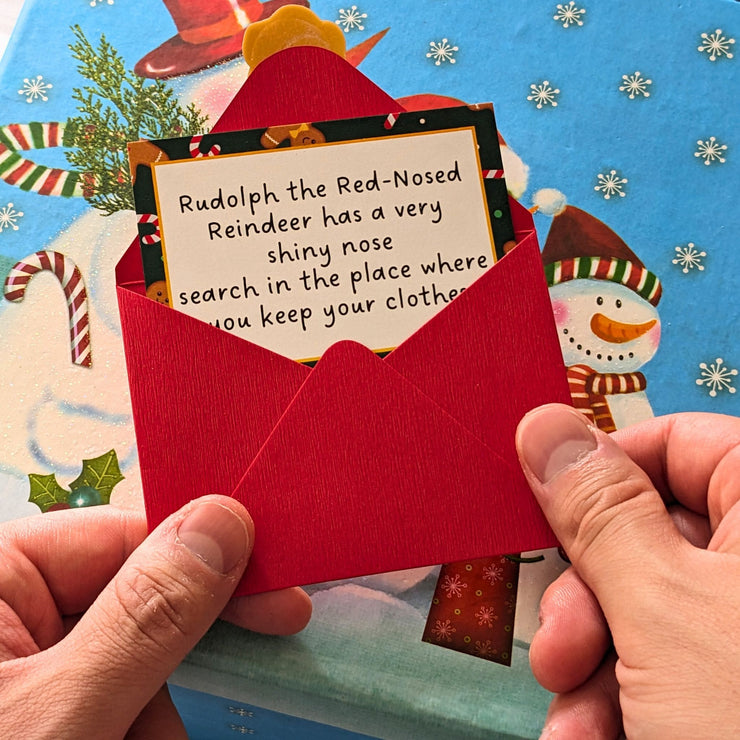 christmas scavenger hunt clue in red envelope that says &