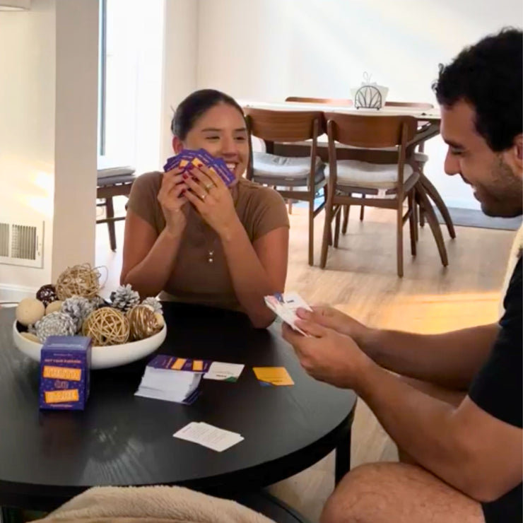 couple playing a truth or dare card game